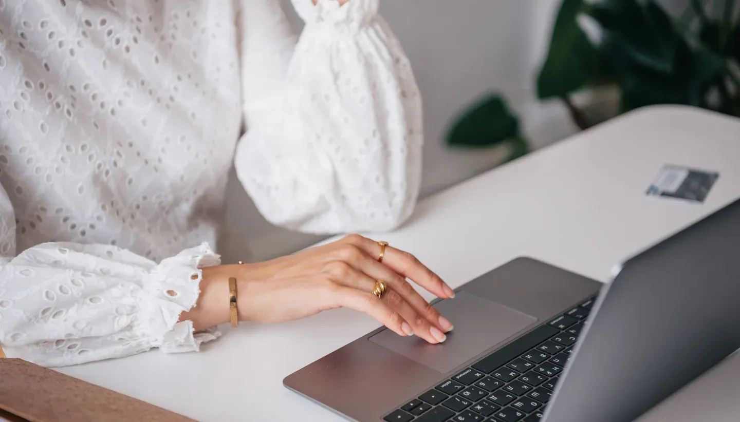 Female hand on laptop